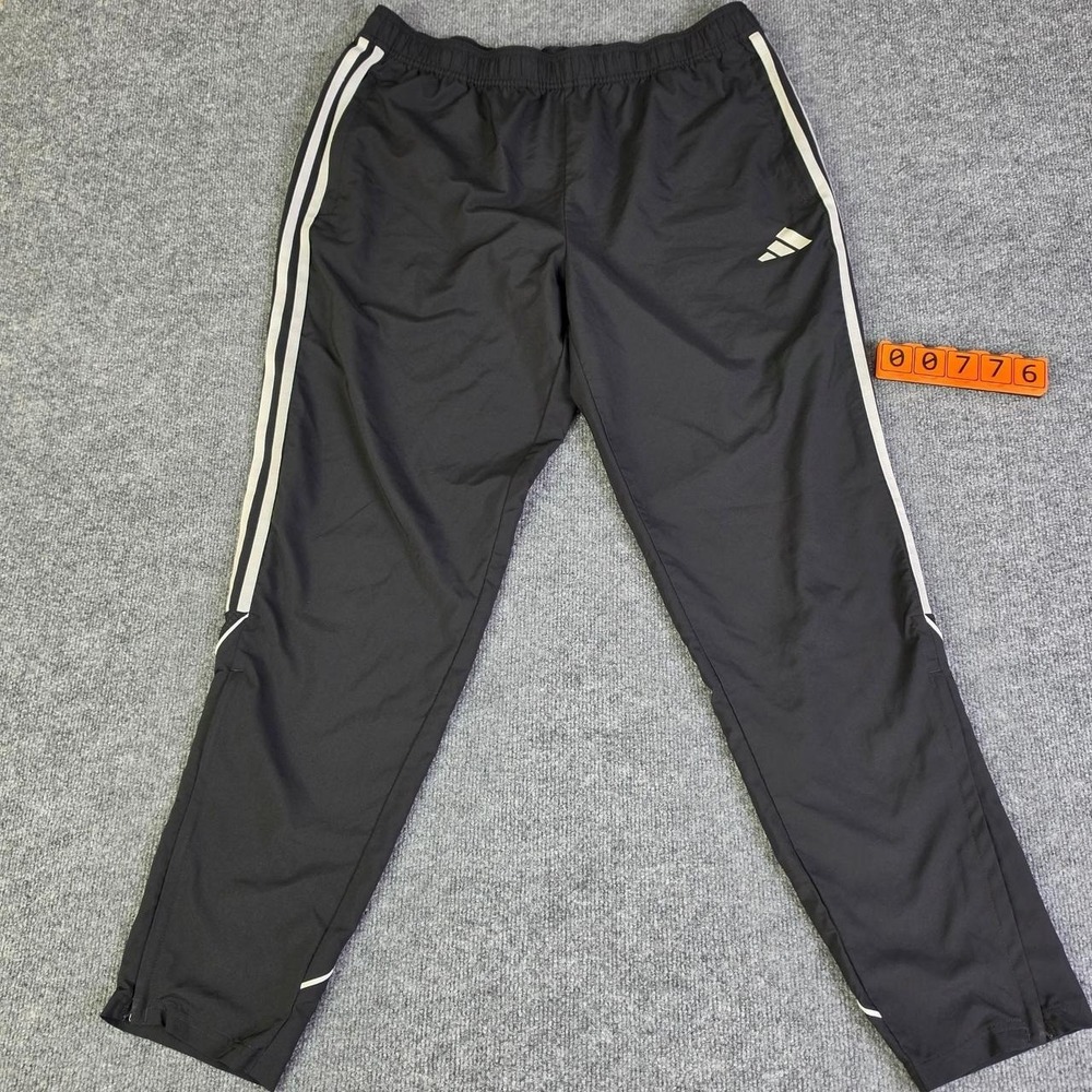 Adidas black track pants with white stripes, size XL